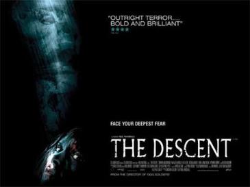 The Descent (2005) poster: a pale face in the dark, a woman looking up, and the title in white
